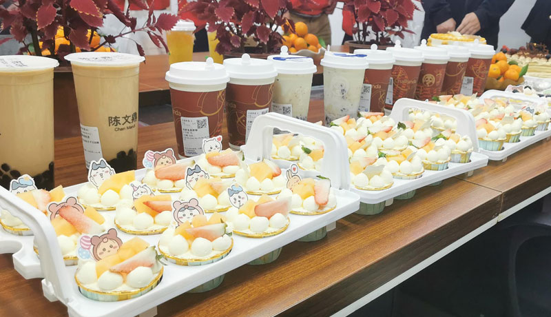 Birthday cake, milk tea, and fruit platter